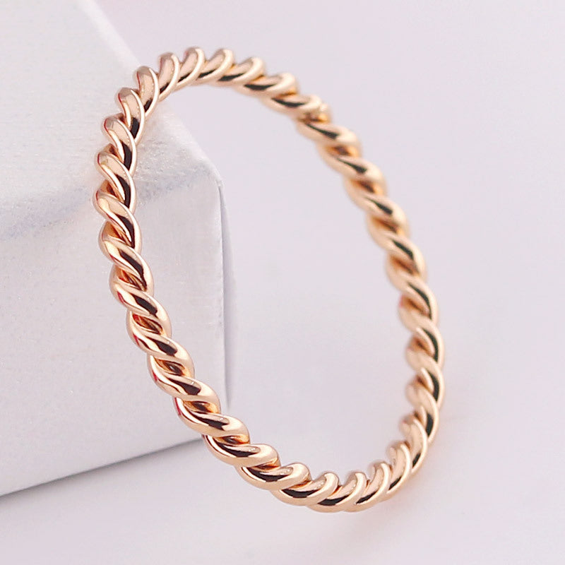 Titanium Steel Twist Pattern Ring Electroplated Finish in Gold or Rose Gold for Ladies and Girls Sizes 4 to 11