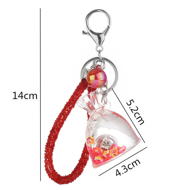 Yellow Acrylic Keychain With Liquid Quicksand Money Bag Design Rope Accent Fashion Accessory Durable Plastic Finish