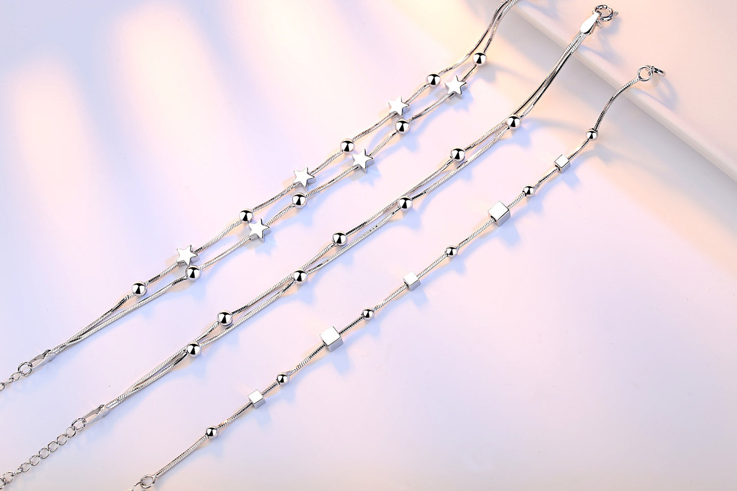 Sterling Silver Bracelet For Women And Girls With Five Point Star Ball And Square Charms Platinum Finish Shine