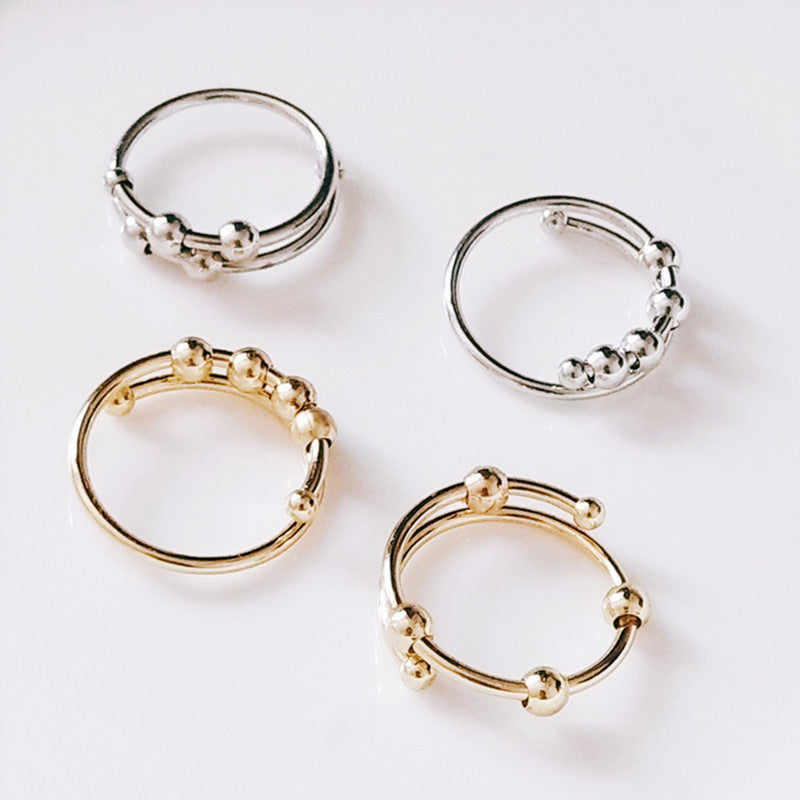 Adjustable Alloy Ring With Turning Beads For Stress Relief