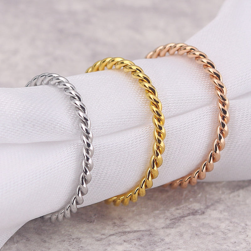 Titanium Steel Twist Pattern Ring Electroplated Finish in Gold or Rose Gold for Ladies and Girls Sizes 4 to 11