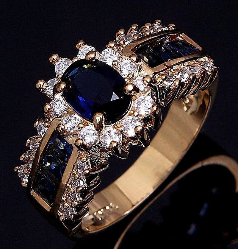 Gold Plated Alloy Ring With Blue Zircon Inlay And Red Zirconia Flower Design Electroplated Finish Metal Accents Details