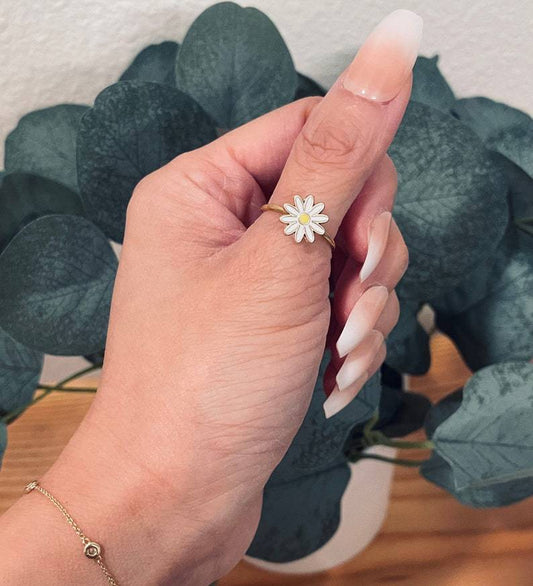Gold Plated Copper Ring Featuring A Small Daisy Design Rotating Mechanism And Adjustable Opening For Versatile Jewelry