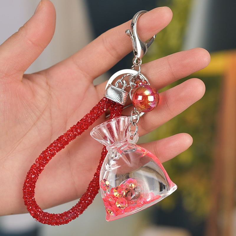 Yellow Acrylic Keychain With Liquid Quicksand Money Bag Design Rope Accent Fashion Accessory Durable Plastic Finish