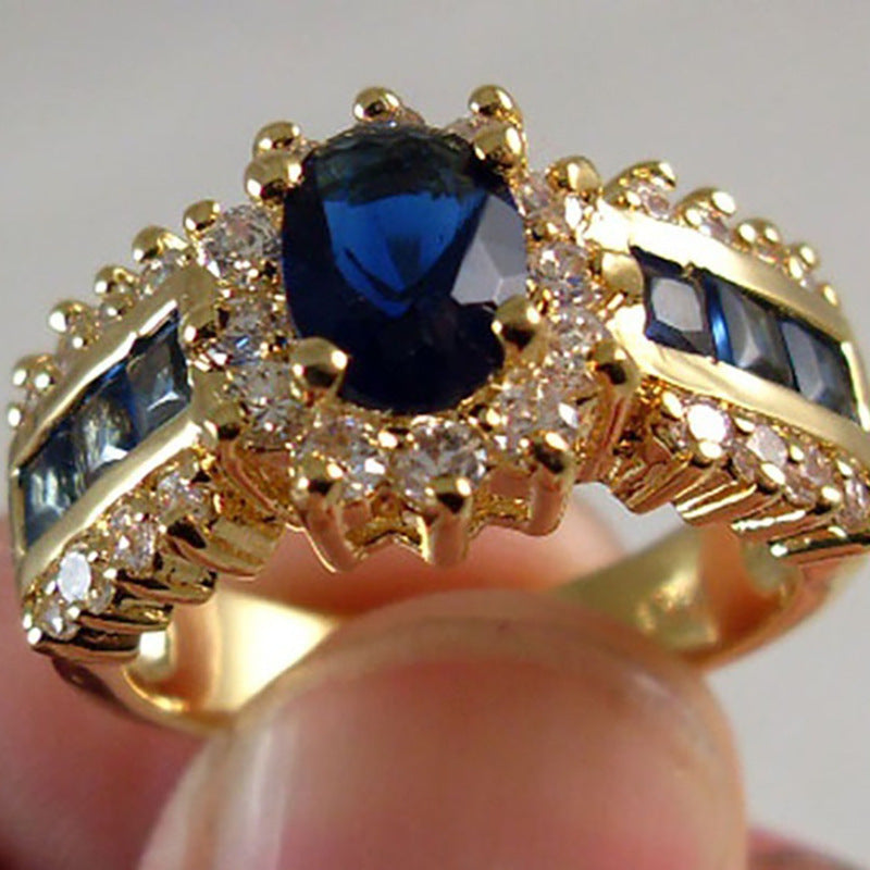 Gold Plated Alloy Ring With Blue Zircon Inlay And Red Zirconia Flower Design Electroplated Finish Metal Accents Details