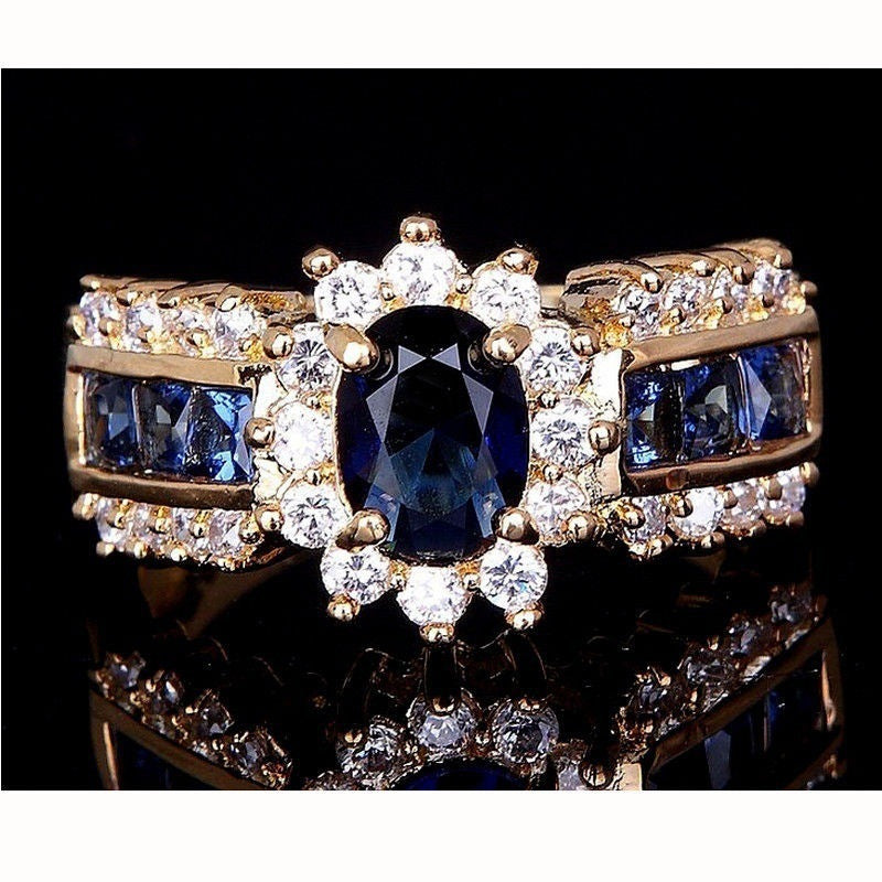 Gold Plated Alloy Ring With Blue Zircon Inlay And Red Zirconia Flower Design Electroplated Finish Metal Accents Details